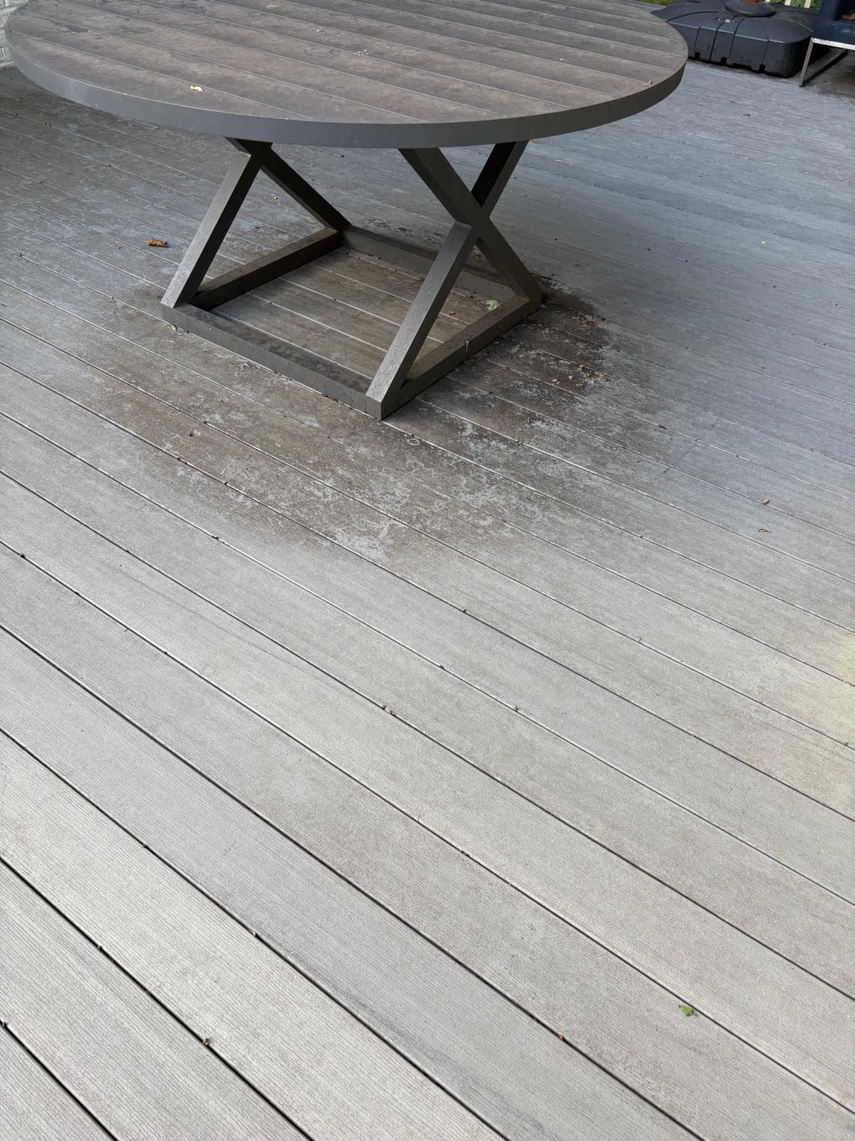Deck around outdoor table before cleaning in Millburn NJ